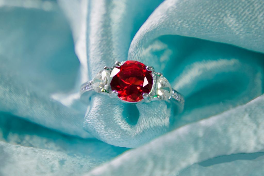 Stunning Red Ruby Gemstone Ring on Aqua Fabric