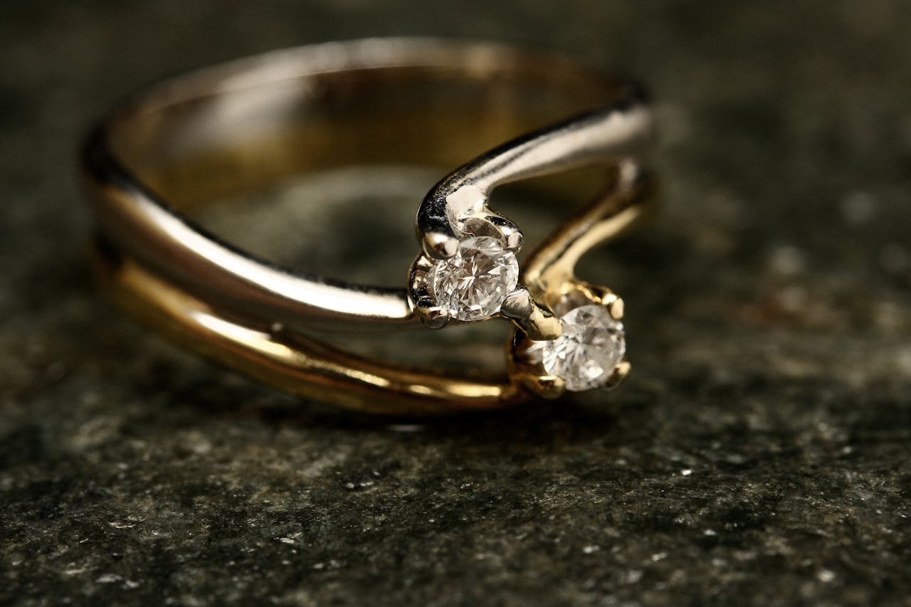Crafting Captivating Headlines: Your awesome post title goes here Close-up of an exquisite diamond ring with gold and platinum bands symbolizing luxury and elegance.