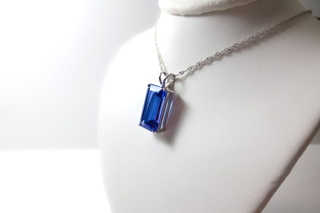 tanzanite, tanzania, blue, purple, white, gold, stone, crystal, emerald, cut, faceted, necklace, jewelry, luxury, violet, gem, precious, light, rare, transparent, mineral, africa, mine, specimen, health, geology, crystalline, mineralogy, gemstone, throat, fine, beautiful, chain, pendant, expensive, gift, neck, travel, rectangle